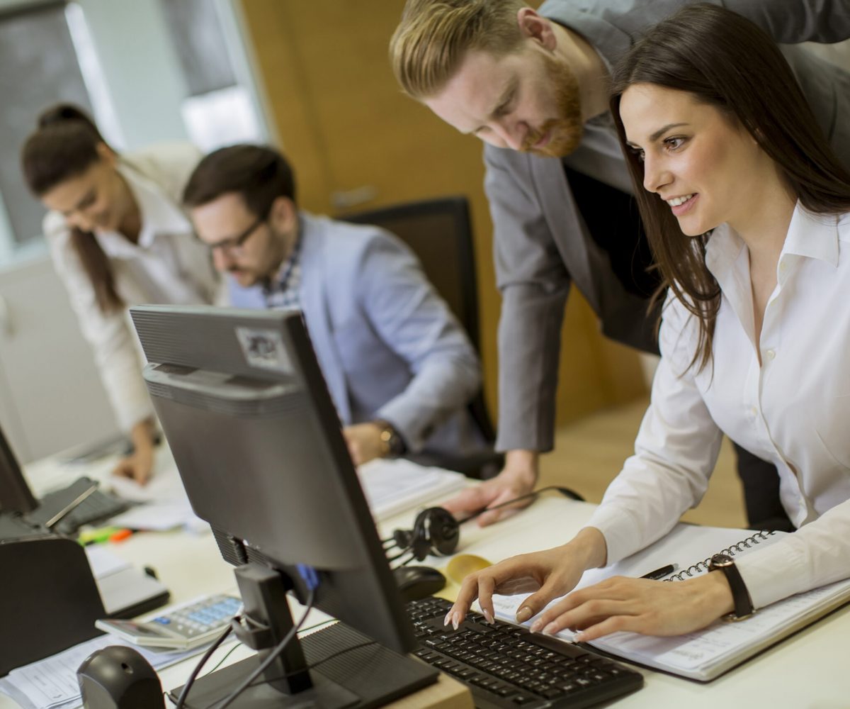 Group of young people working in the modern office